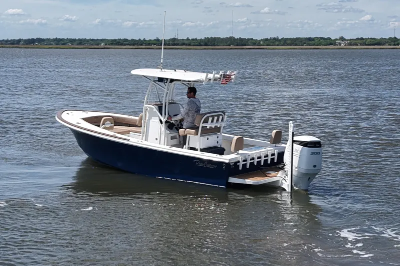 Slide: The Image of 2022 Pair Customs 21 Center Console DV boat on calm water. - 6