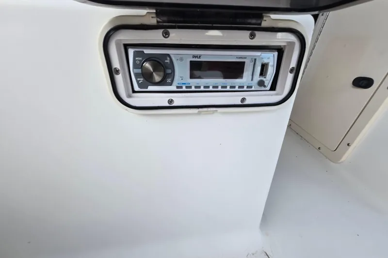 Slide: The Image of 1994 Sea Pro 190 Dual Console boat stereo system, featuring a modern audio unit. - 14
