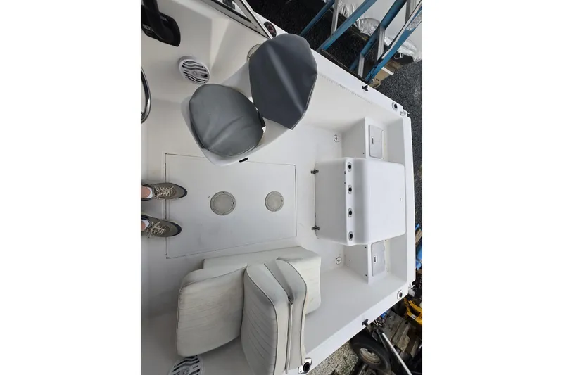Slide: The Image of 1994 Sea Pro 190 Dual Console interior with seating and storage compartments. - 3