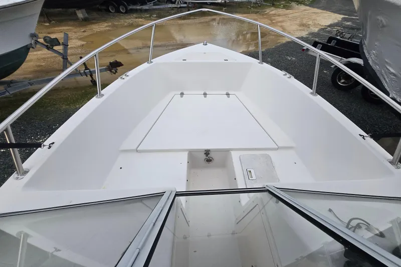 Slide: The Image of 1994 Sea Pro 190 Dual Console boat deck with open bow seating area. - 6