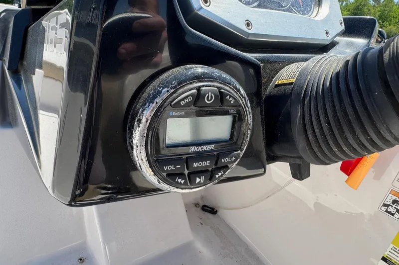 Slide: The Image of Control panel of a 2017 Scarab 165 H.O. Platinum boat with audio system. - 12