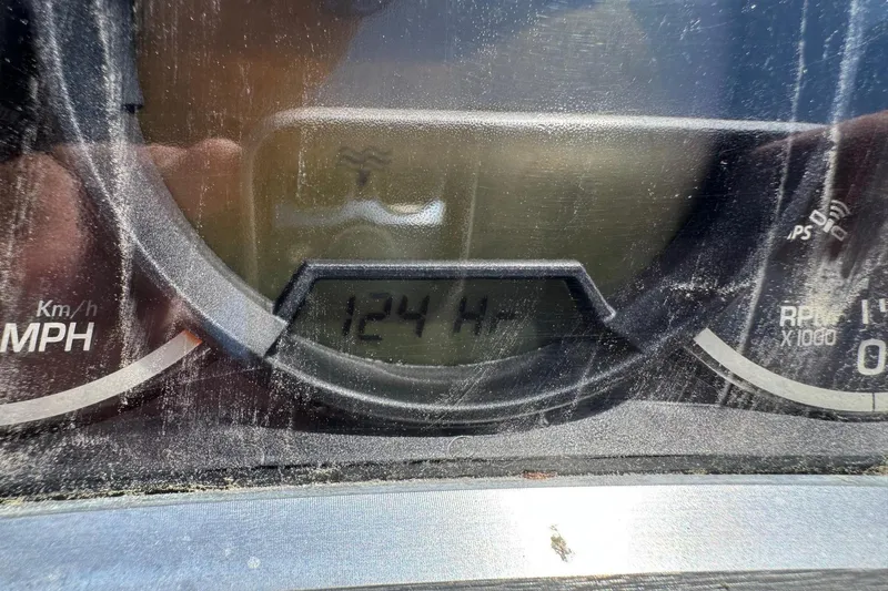 Slide: The Image of Close-up of a 2017 Scarab 165 H.O. Platinum speedometer showing 124 hours. - 13