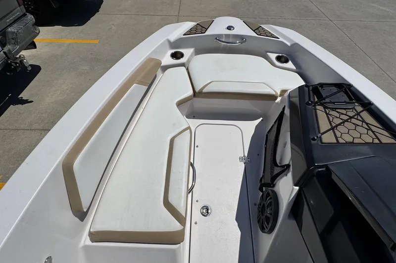 Slide: The Image of 2017 Scarab 165 H.O. Platinum boat interior with white seating and storage compartments. - 7
