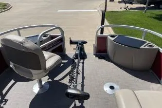 Slide: The Image of 2022 Sun Tracker Fishin' Barge 20 DLX interior with seating and fishing equipment. - 6