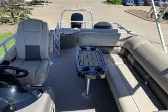 Slide: The Image of 2022 Sun Tracker Fishin' Barge 20 DLX interior with seating and table. - 7