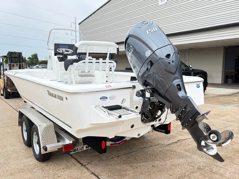 Slide: The Image of 2026 Tidewater 2110 Bay Max boat with outboard motor. - 6