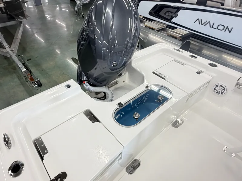 Slide: The Image of 2026 Tidewater 2110 Bay Max boat with engine and storage compartments. - 7