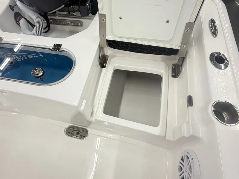 Slide: The Image of Tidewater 2110 Bay Max 2026 boat with storage compartment and rod holders. - 9