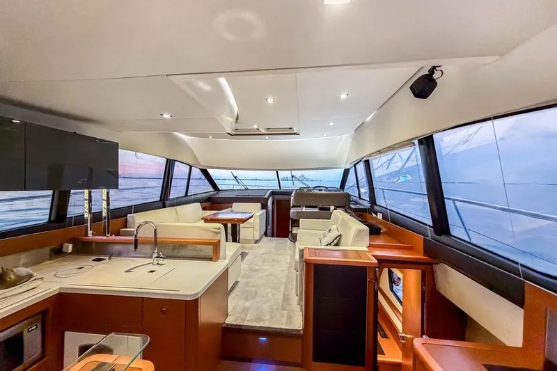 Slide: The Image of Luxurious interior of a 2013 Prestige 500 yacht with modern furnishings and panoramic windows. - 10
