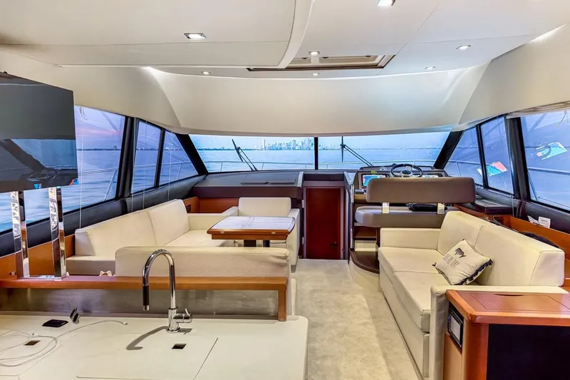 Slide: The Image of Luxurious interior of a 2013 Prestige 500 yacht with panoramic windows and elegant seating. - 11
