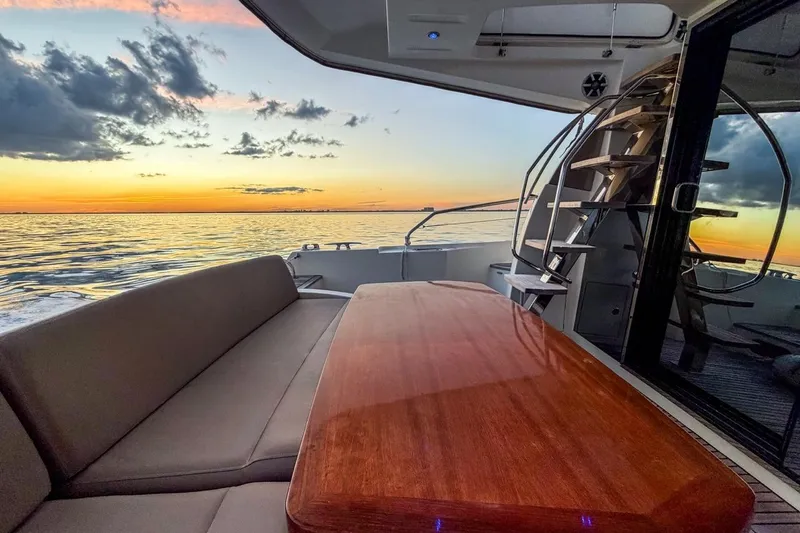 Slide: The Image of Luxurious 2013 Prestige 500 yacht interior with sunset view over the ocean. - 12