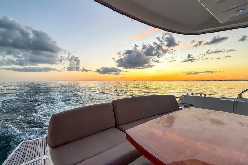 Slide: The Image of Prestige 500 yacht at sunset, 2013 model, with ocean view and seating area. - 13