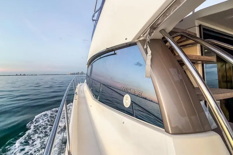 Slide: The Image of Luxury yacht Prestige 500 cruising on calm waters at sunset, 2013 model. - 15