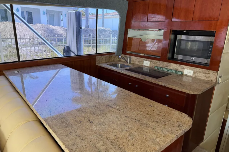 Slide: The Image of Luxurious kitchen interior of 1985 Ocean Yachts 55 Super Sport with granite countertops. - 13