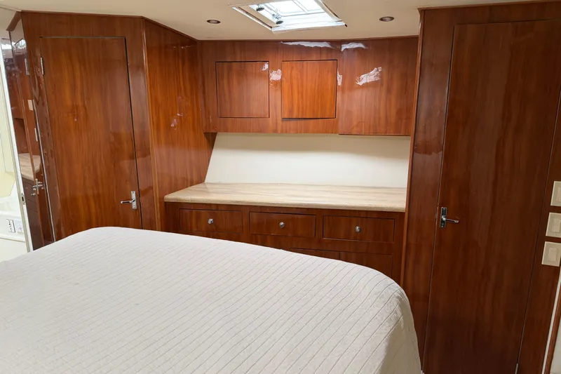 Slide: The Image of Luxurious wood-paneled cabin interior of 1985 Ocean Yachts 55 Super Sport. - 19