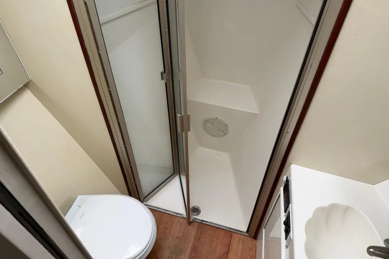 Slide: The Image of Bathroom interior of 1985 Ocean Yachts 55 Super Sport with shower, toilet, and sink. - 20