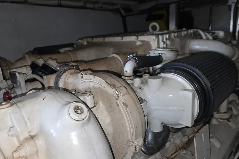 Slide: The Image of Engine of 1985 Ocean Yachts 55 Super Sport, showcasing mechanical components and details. - 27