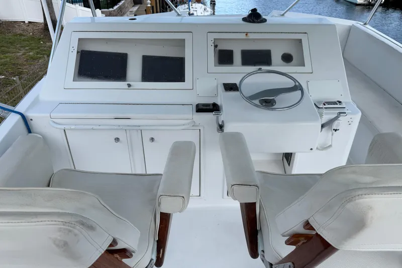Slide: The Image of Cockpit of 1985 Ocean Yachts 55 Super Sport with dual seats and steering wheel. - 3