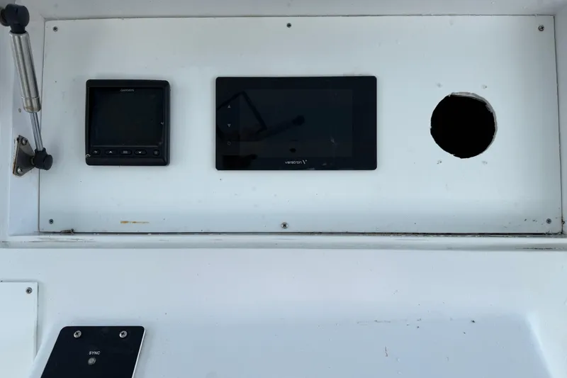 Slide: The Image of Control panel of a 1985 Ocean Yachts 55 Super Sport boat with navigation equipment. - 7
