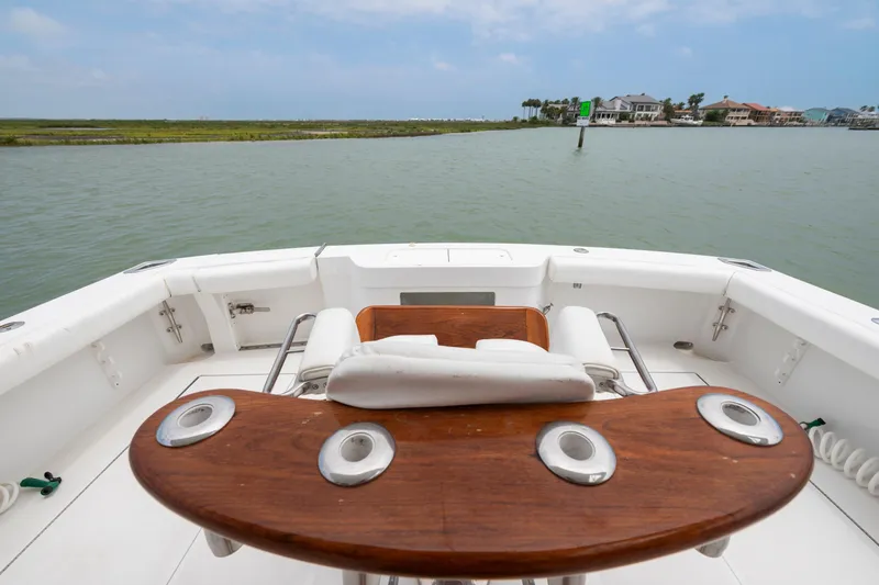 Slide: The Image of 2005 Cabo 40 Flybridge boat deck with scenic waterfront view. - 16