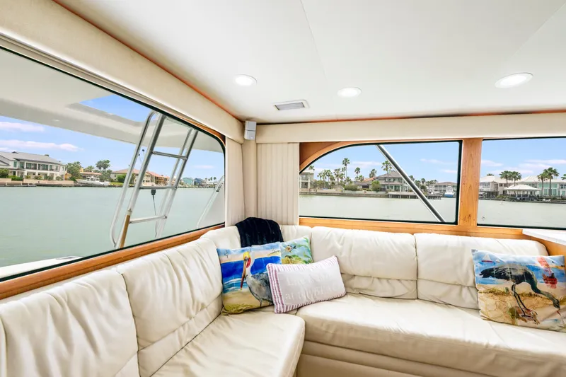 Slide: The Image of Luxurious interior of 2005 Cabo 40 Flybridge yacht with waterfront view. - 19