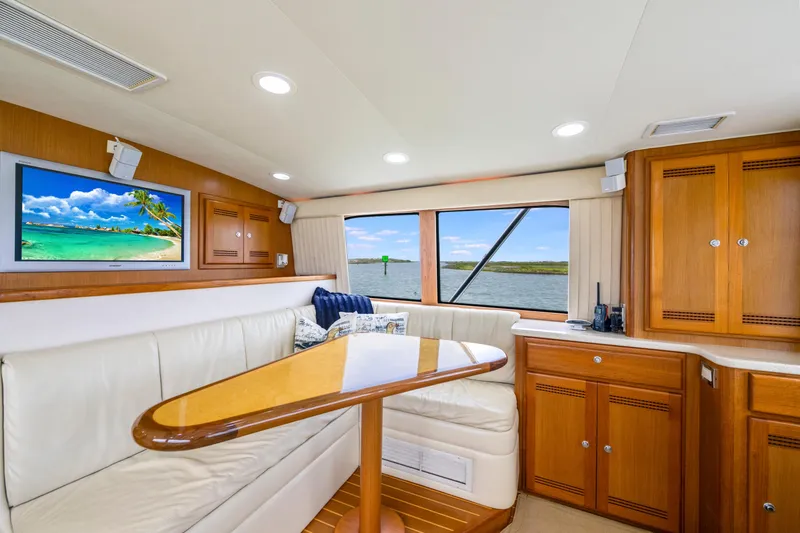 Slide: The Image of Luxurious interior of 2005 Cabo 40 Flybridge yacht with elegant seating and scenic window view. - 20