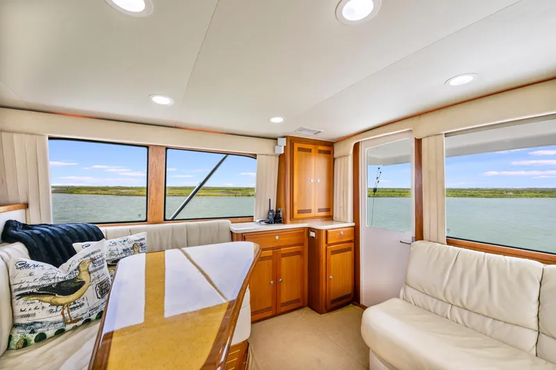 Slide: The Image of Luxurious interior of 2005 Cabo 40 Flybridge yacht with scenic water views. - 21