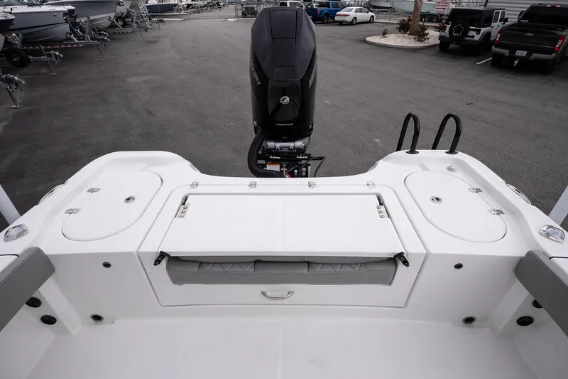 Slide: The Image of 2026 Blazer Bay Makaira 2600 boat deck with motor and storage compartments. - 13