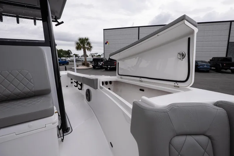 Slide: The Image of 2026 Blazer Bay Makaira 2600 boat interior with open storage compartment and seating. - 20