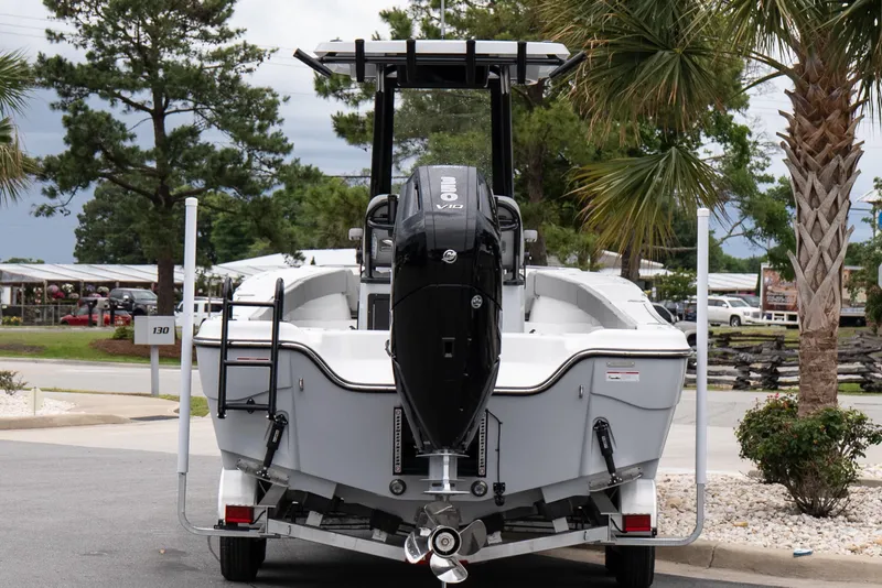 Slide: The Image of 2026 Blazer Bay Makaira 2600 boat with powerful outboard motor, parked outdoors. - 5