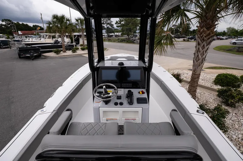 Slide: The Image of 2026 Blazer Bay Makaira 2600 boat interior with steering console and seating. - 8