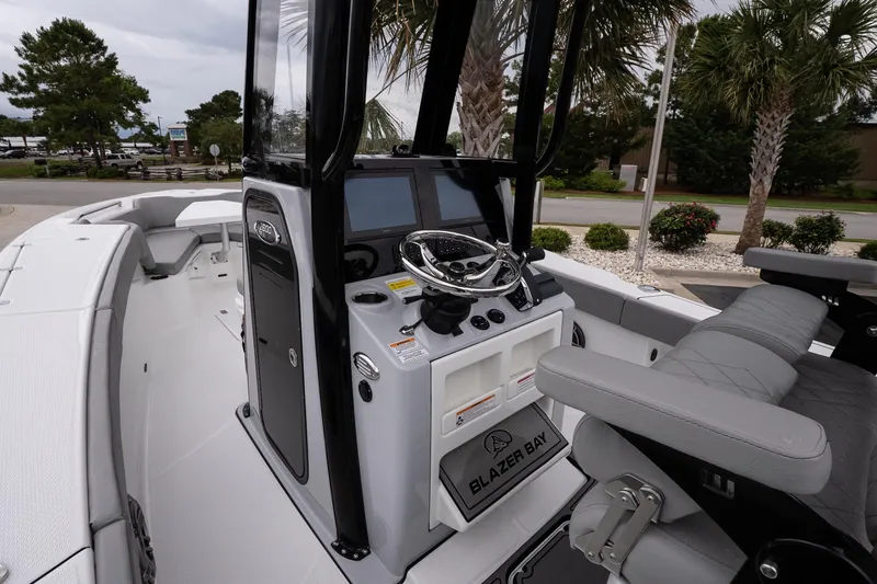 Slide: The Image of 2026 Blazer Bay Makaira 2600 boat interior with modern console and seating. - 9