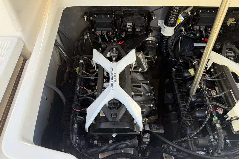 Slide: The Image of Engine compartment of 2026 Yamaha Boats 222 FSH Sport E, showcasing high-performance components. - 4