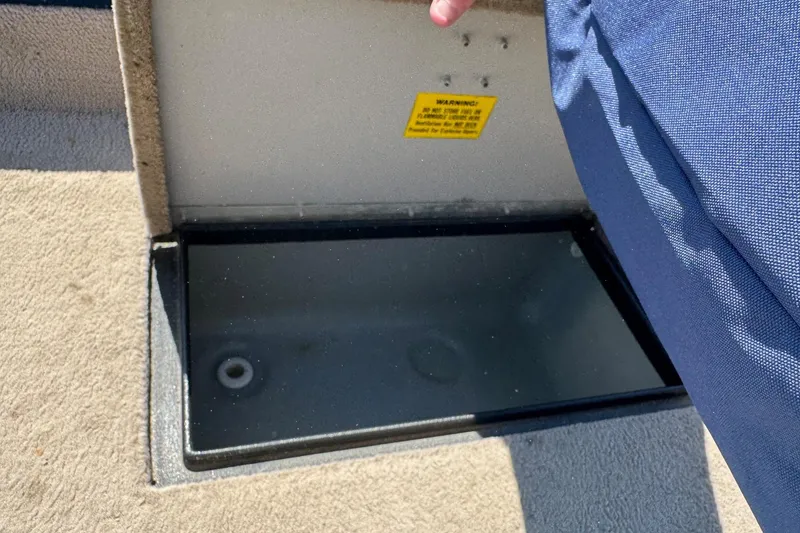Slide: The Image of Open storage compartment on 1997 Starcraft Stardeck 190 Fish boat. - 11