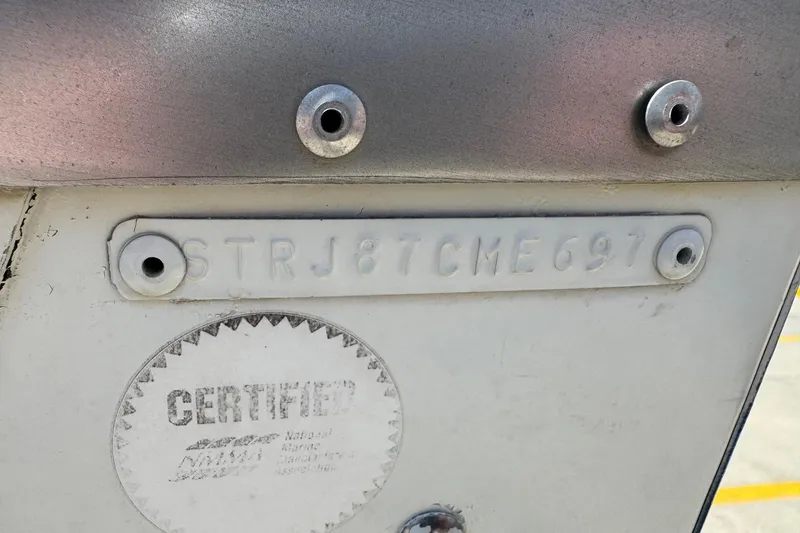 Slide: The Image of 1997 Starcraft Stardeck 190 Fish boat hull identification number and certification label. - 14