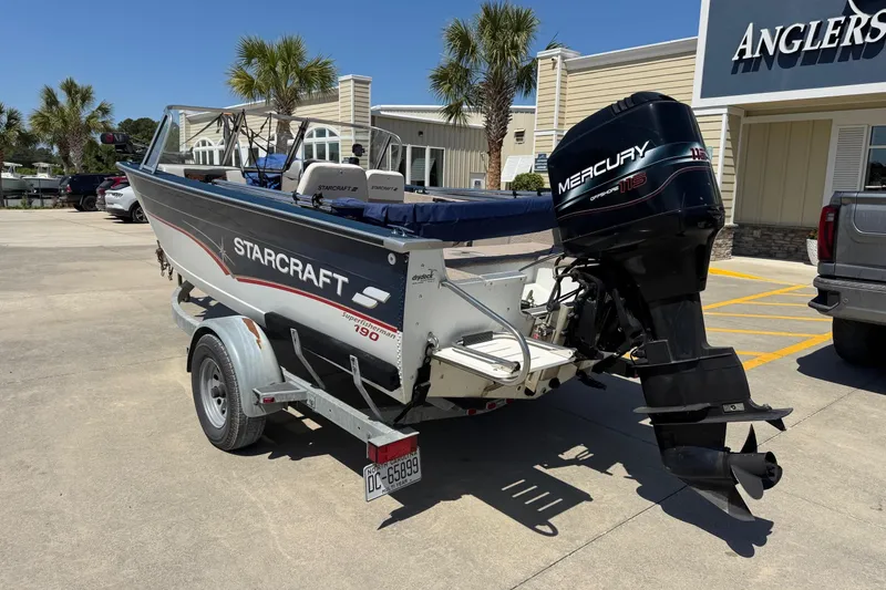 Slide: The Image of 1997 Starcraft Stardeck 190 Fish boat with Mercury outboard motor on trailer. - 3