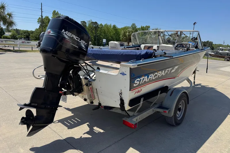 Slide: The Image of 1997 Starcraft Stardeck 190 Fish boat with Mercury outboard motor on trailer. - 5