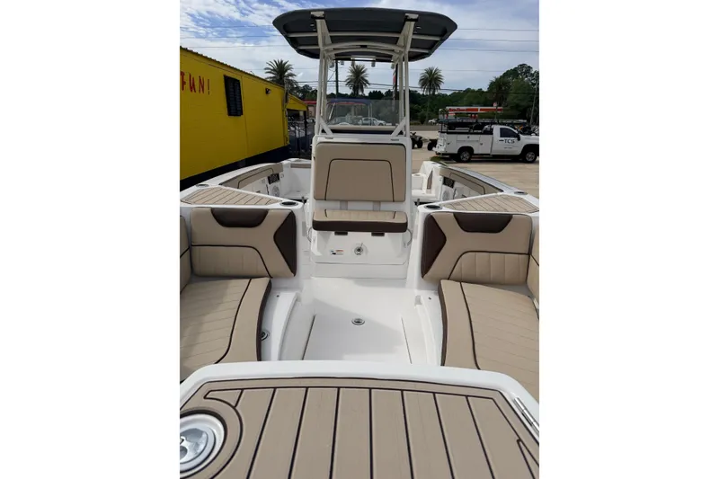Slide: The Image of 2026 Yamaha Boats 222 FSH Sport interior with tan seating and sleek design. - 12