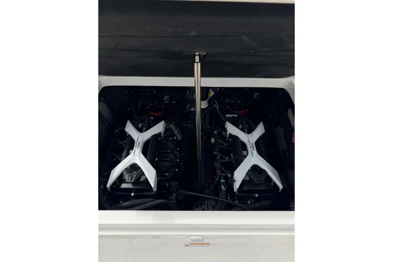 Slide: The Image of 2026 Yamaha Boats 222 FSH Sport engine compartment with dual engines visible. - 19
