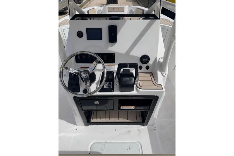 Slide: The Image of 2026 Yamaha Boats 222 FSH Sport dashboard with steering wheel and controls. - 7