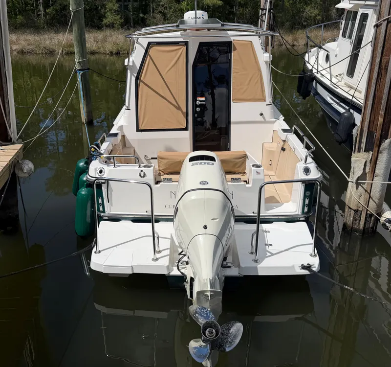 Slide: The Image of 2018 Ranger Tugs R-23 boat docked at marina. - 1
