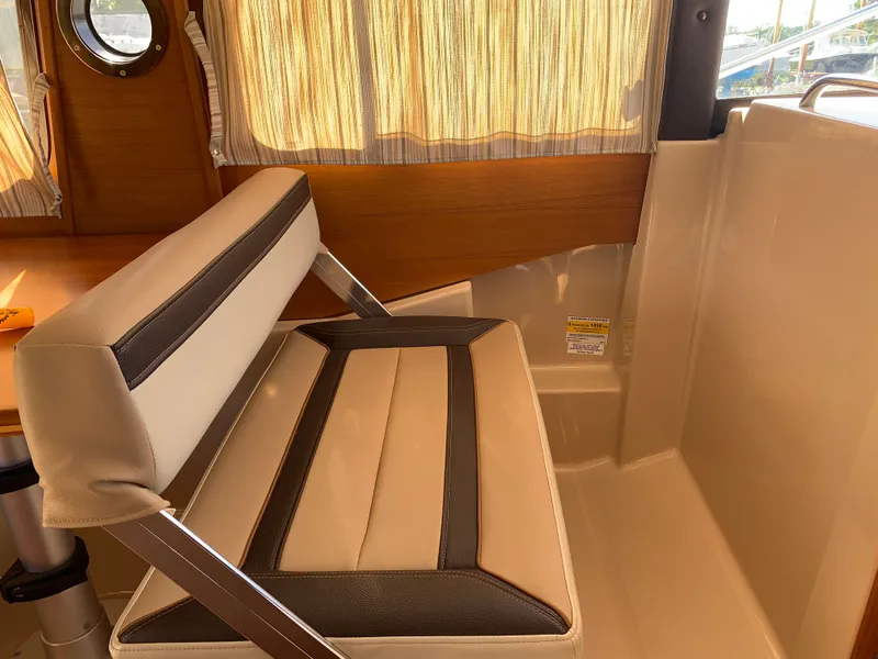 Slide: The Image of Interior of Ranger Tugs R-23 boat, seating area, year 2018. - 12