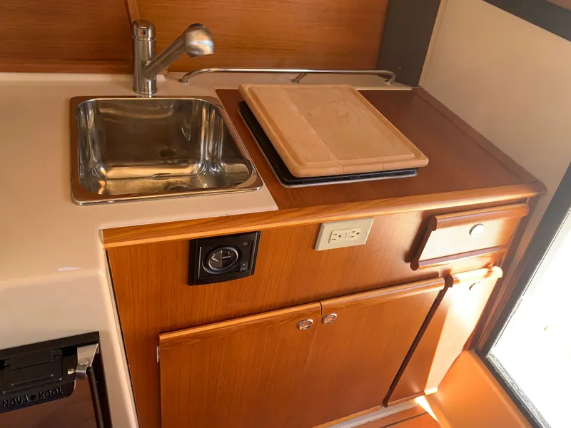 Slide: The Image of Kitchen area of Ranger Tugs R-23 yacht, 2018 model. - 14