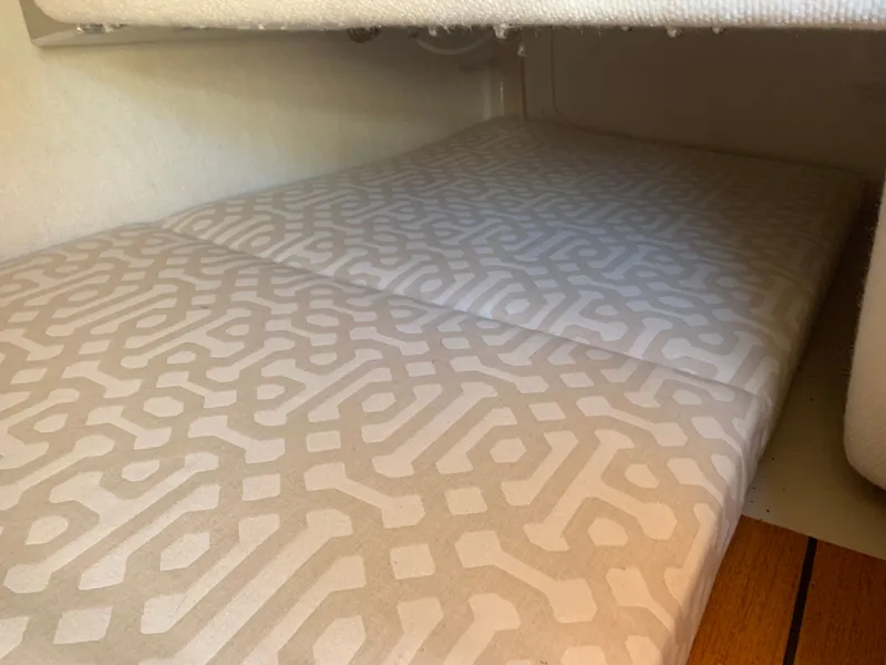 Slide: The Image of Interior of 2018 Ranger Tugs R-23 boat with patterned upholstery. - 23