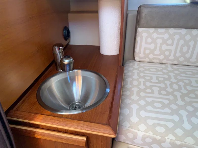Slide: The Image of Interior of 2018 Ranger Tugs R-23 with sink and seating area. - 27