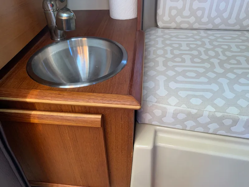Slide: The Image of Interior of 2018 Ranger Tugs R-23 with sink and seating. - 28