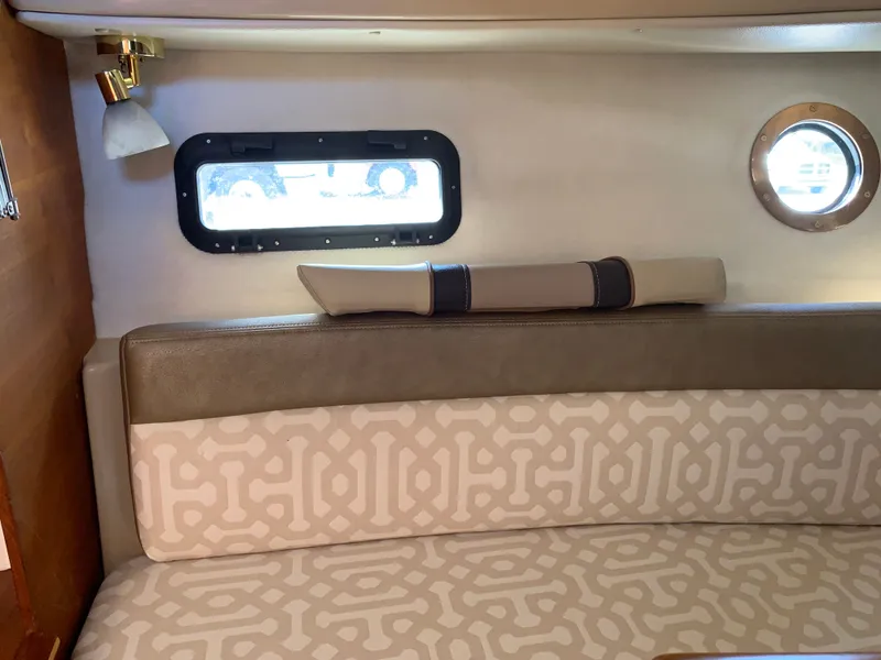 Slide: The Image of Interior of 2018 Ranger Tugs R-23 boat with cushioned seating. - 29
