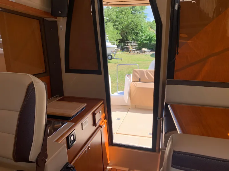 Slide: The Image of Interior of a 2018 Ranger Tugs R-23 with outdoor view. - 32