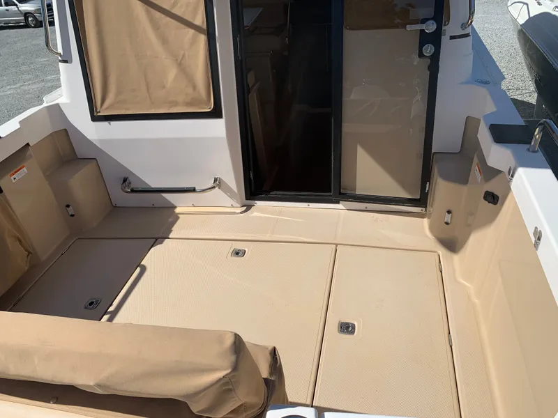 Slide: The Image of Ranger Tugs R-23 2018 boat cockpit with beige interior. - 33