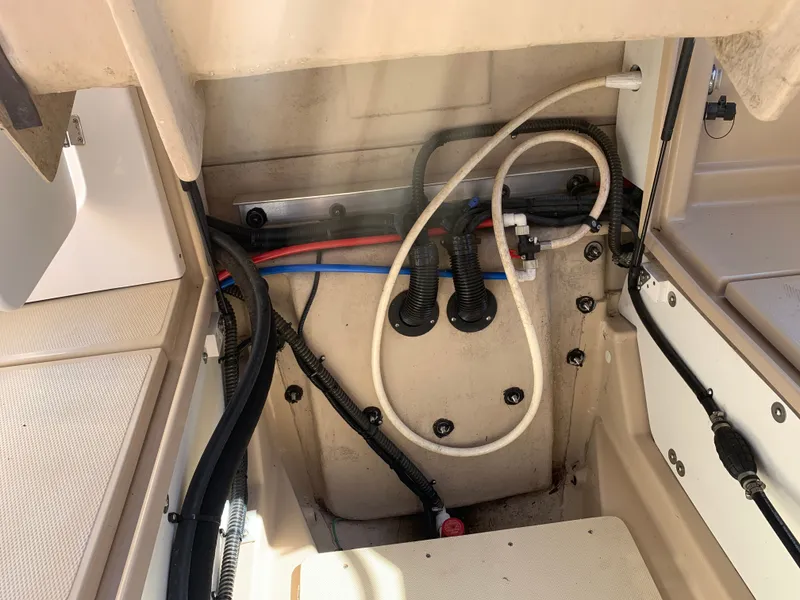 Slide: The Image of Interior of a 2018 Ranger Tugs R-23 boat, showing wiring and hoses. - 39